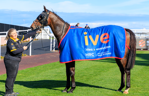 Band Of Brothers sports the winner's rug (image Grant Courtney)