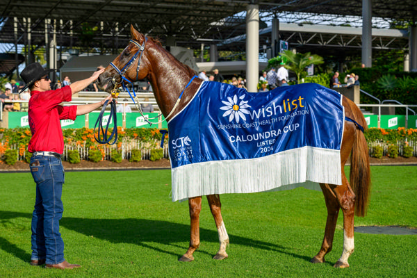 Sporting the winners spoils (image Magic Millions/Michael McInally)