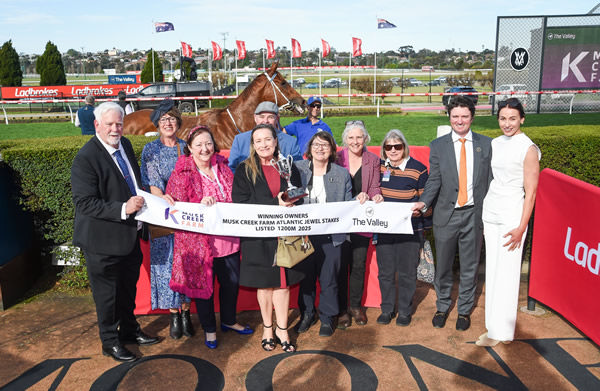 Alpha Sofie and her owners celebrate - image Racing Photos
