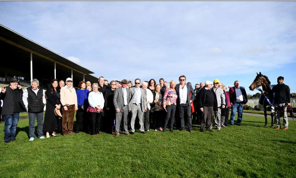 Bonny Lass pictured with the 50-strong Social Racing Starting Gates Syndicate following her win at Te Rapa on Saturday.  Photo: Kenton Wright (Race Images)