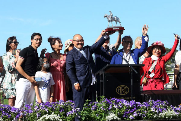 Happy connections celebrate the victory of Dragon Queen at Ellerslie. Photo: Kristin Ledington