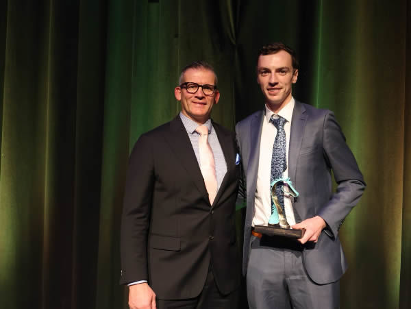 Finn McCarthy of McEvoy Mitchell Racing receives the Leadership Award from Luke Kinniburgh of the Victoria Racing Club.