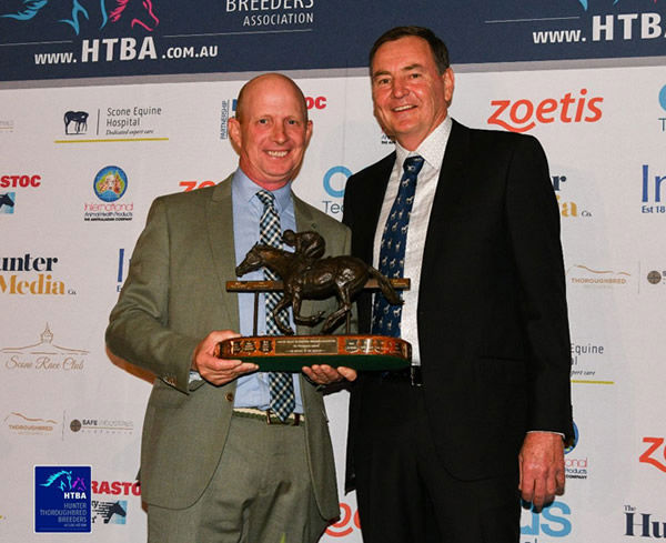 John Sunderland receives his award.