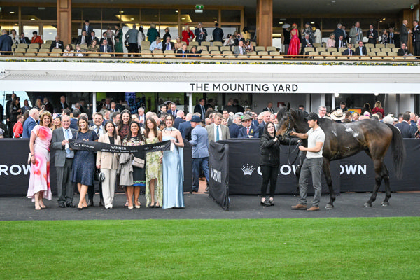 Revelare and his happy owners - Colleen Bamford is third from the right - image Racing Photos 