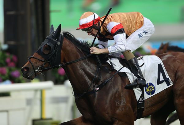 Hugh Bowman drives Atullibigeal to victory over 1600m at Sha Tin on Sunday. Photo: HKJC