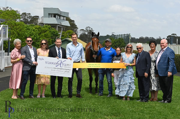 Benzou and his owners celebrate a lucrative win - image Bradley Photography