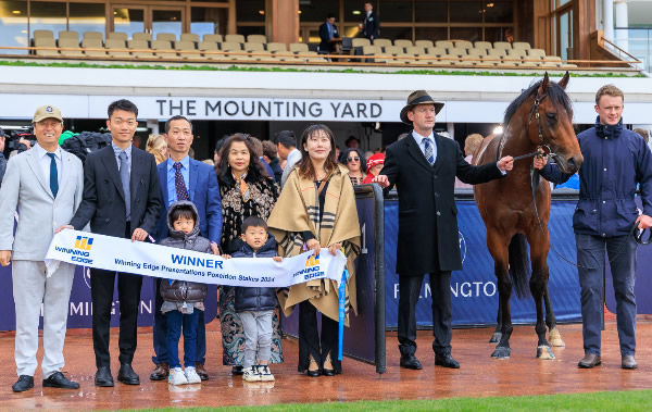 Mr Zhangh and his family were on hand for the win - image Grant Courtney