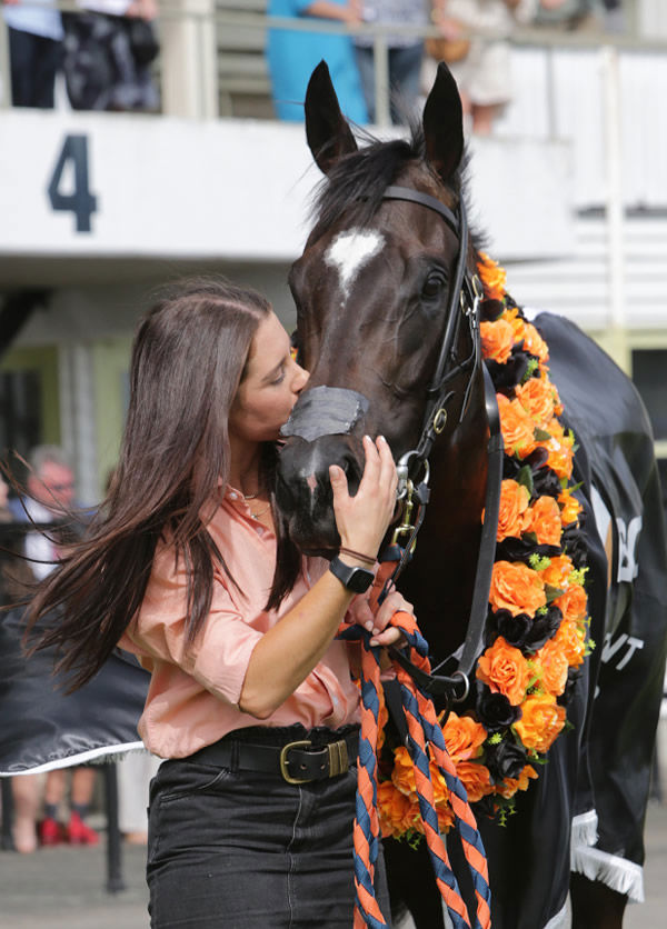 Strapper Laura Macnab showers Imperatriz with plenty of love after her stunning Te Rapa victory Photo: Trish Dunell