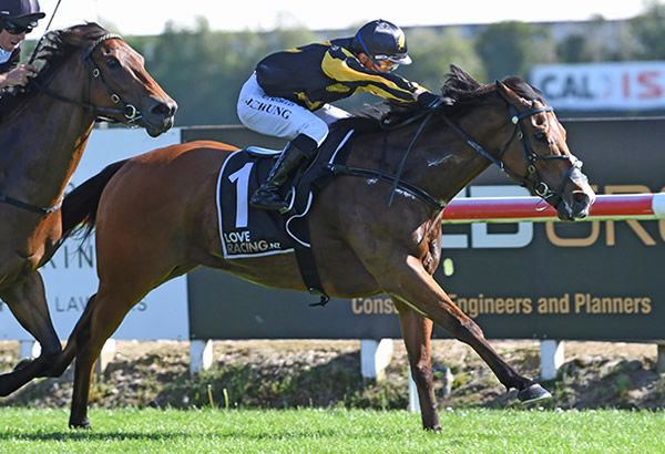 Johny Johny and apprentice Jim Chung power home in the Gr.3 Sweynesse Stakes (1200m) at Te Rapa.  Photo: Kenton Wright (Race Images)