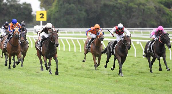 Levante (left, white cap) has the situation under control as she defeats La Crique (centre) and Chase (right) in the Gr.1 El Cheapo Cars WFA Classic (1600m) Photo: Race Images – Peter Rubery