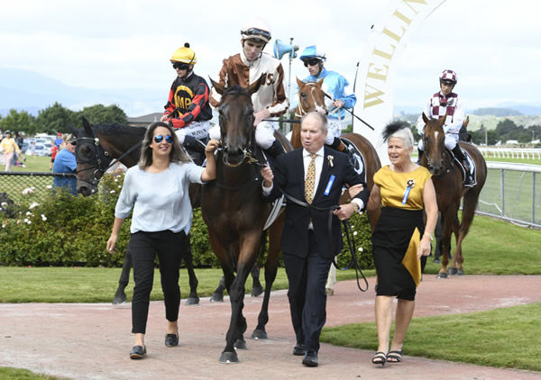 Part owner Philip Brown and wife Catherine (far right) bring Levante back to the Trentham birdcage Photo Credit: Race Images- Peter Rubery