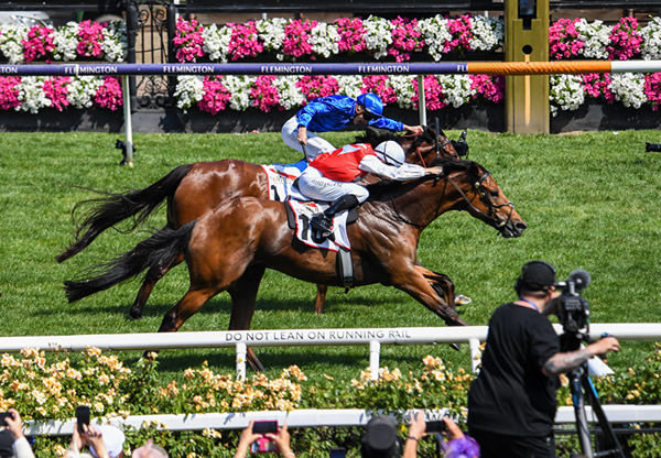 Naejm Suhail turns the tables on Spacewalk to win the Listed Mumm Stakes - image Pat Scala / Racing Photos
