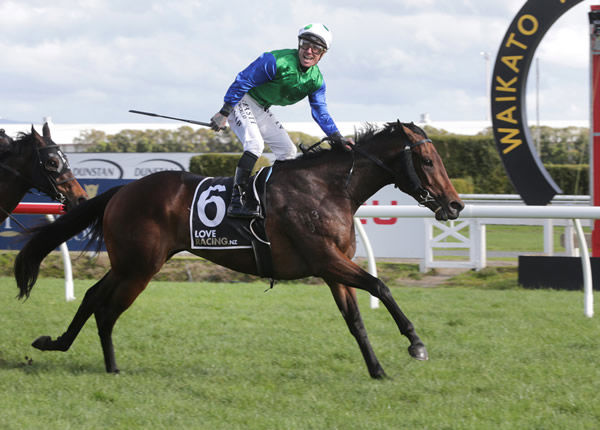 An excited Michael McNab salutes after his victory aboard Pacific Dragon in the Listed Courtesy Ford Ryder Stakes (1200m) at Te Rapa Photo credit: Trish Dunell
