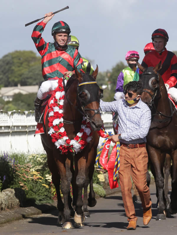 Craig Grylls salutes as he brings Rocket Spade back to the Ellerslie birdcage after victory in the Gr.1 Vodafone New Zealand Derby (2400m) Photo: Trish Dunell