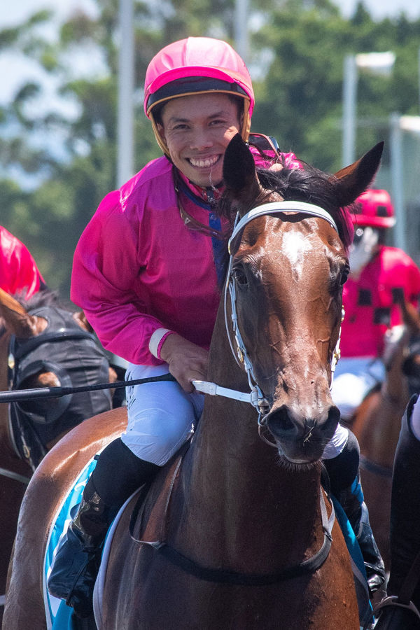 Can't wipe the smile off Allan Chau's face (image Magic Millions)