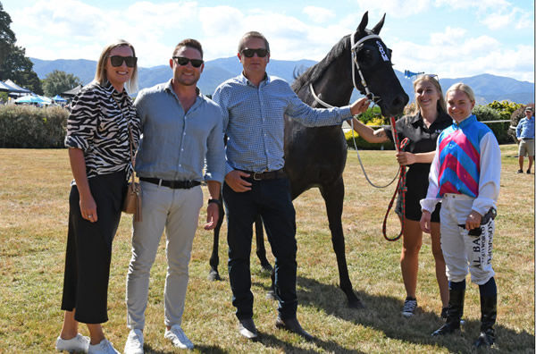 Brendon McCullum and wife Ellissa celebrate the victory of their mare Tabata with trainer Stephen Marsh and jockey Danielle Johnson Photo Credit: Race Images – Peter Rubery