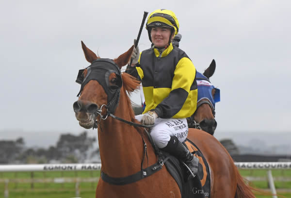 A smiling Courtney Barnes after her victory aboard The Hottie  Photo Credit: Peter Rubery Race Images