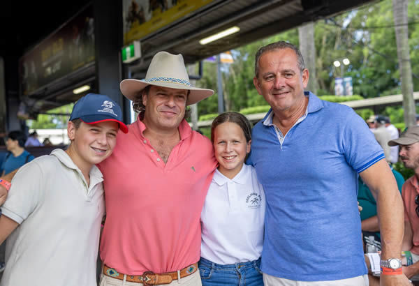 Tom Magnier with children Charlie and Evie and John Camilleri - image Magic Millions