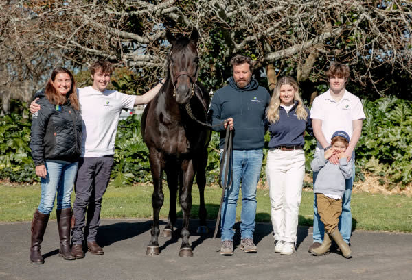 Waikato Stud principal Mark Chittick and his family pictured with the farm's champion stallion Savabeel.  Photo: Supplied